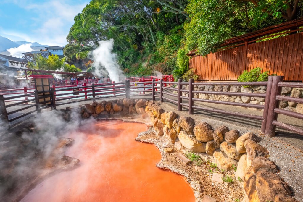 beppu, japan nov 25 2022: kamado jigoku hot spring in beppu, oita. the town is famous for its onsen (hot springs). it has 8 major geothermal hot spots, referred to as the "eight hells of beppu" beppu, japan nov 25 2022: kamado jigoku hot spring in beppu, oita. the town is famous for its onsen (hot springs). it has 8 major geothermal hot spots, referred to as the "eight hells of beppu"